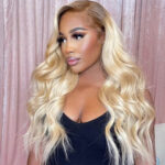 Close-up of 13x4 lace hairline with dark roots transitioning to platinum