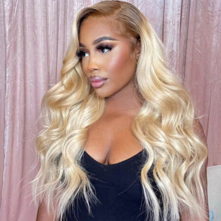 Close-up of 13x4 lace hairline with dark roots transitioning to platinum